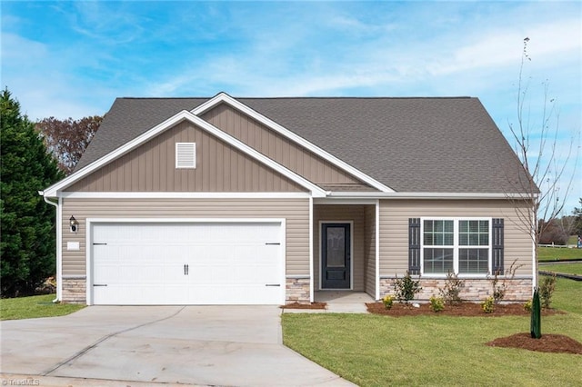 craftsman house with a garage and a front yard