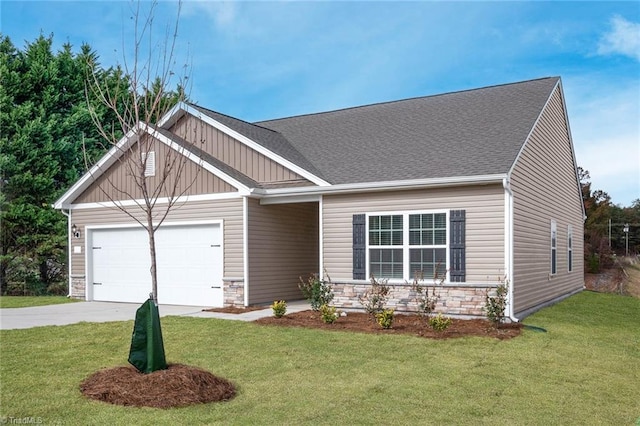 craftsman-style home featuring a garage and a front lawn