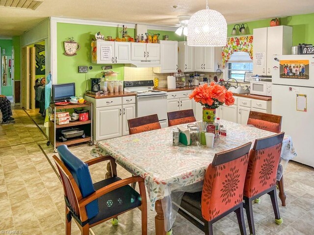 2778 Reynolds Park Rd, Winston-Salem, NC 27107 - kitchen featuring ceiling fan, white appliances, tasteful backsplash, visible vents, and white cabinets