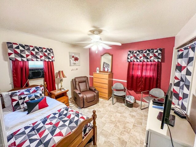 2778 Reynolds Park Rd, Winston-Salem, NC 27107 - bedroom featuring a ceiling fan, cooling unit, and a textured ceiling