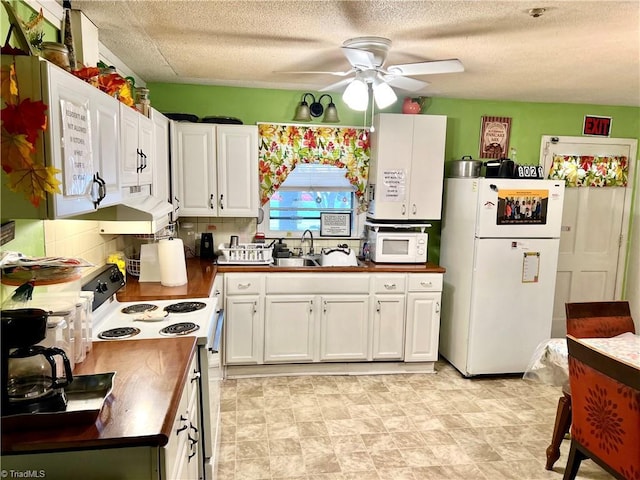 2778 Reynolds Park Rd, Winston-Salem, NC 27107 - kitchen with butcher block counters, white appliances, white cabinetry, and a sink