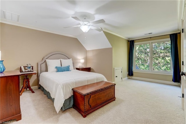 carpeted bedroom with ceiling fan, ornamental molding, and lofted ceiling