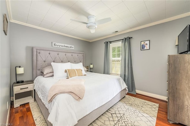 1229 Martin St, Winston-Salem, NC 27103 - bedroom featuring crown molding, wood finished floors, baseboards, and a ceiling fan