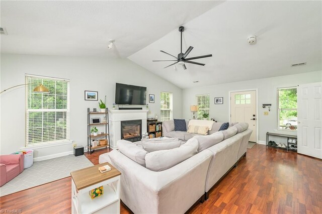 1229 Martin St, Winston-Salem, NC 27103 - living area with ceiling fan, dark wood-type flooring, a glass covered fireplace, plenty of natural light, and lofted ceiling