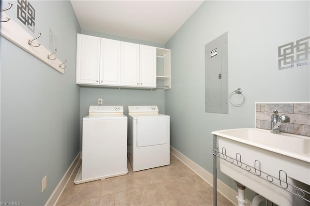 laundry room with independent washer and dryer, cabinets, electric panel, and light tile patterned floors