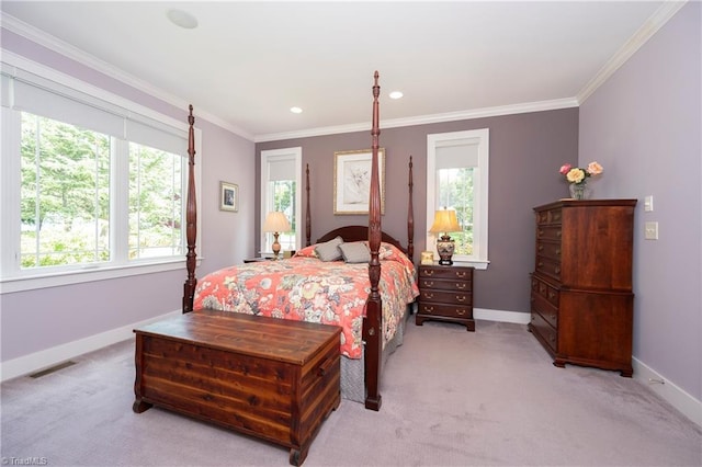 bedroom featuring ornamental molding and light carpet