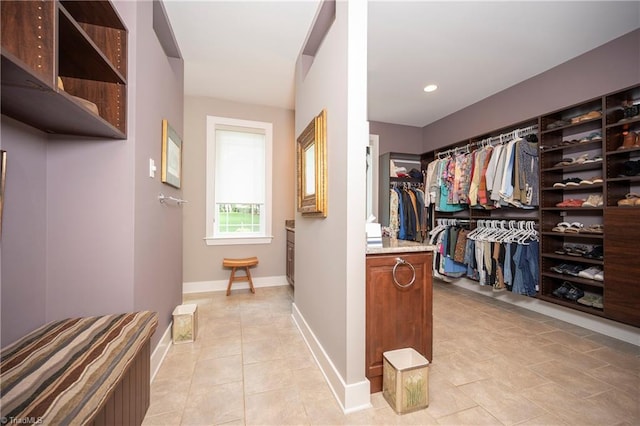 spacious closet featuring light tile patterned floors