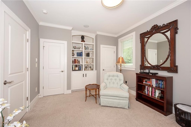 sitting room featuring light colored carpet and ornamental molding