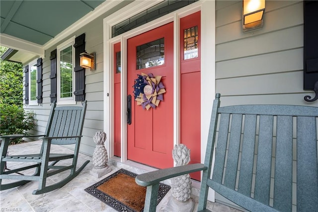 doorway to property featuring a porch