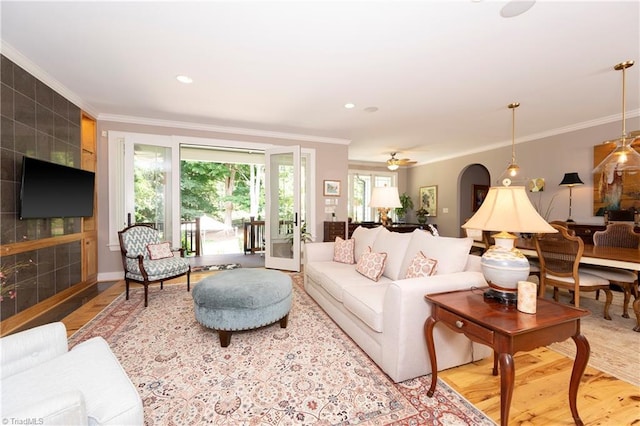 living room featuring ornamental molding and hardwood / wood-style floors