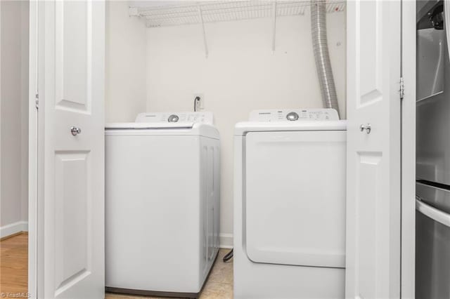 laundry room featuring washing machine and dryer