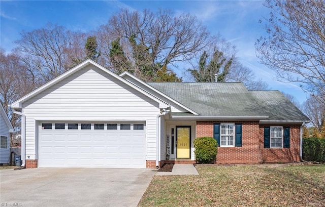 single story home featuring a front lawn and a garage