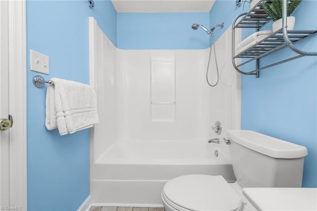 bathroom with shower / bathtub combination and toilet