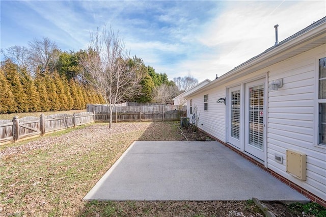 view of yard featuring central air condition unit and a patio area