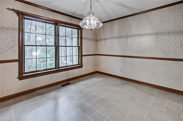 empty room with a notable chandelier, a textured ceiling, and ornamental molding