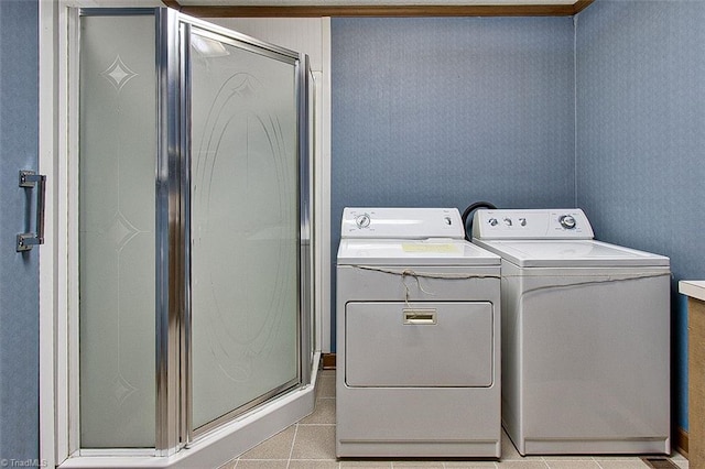 washroom featuring independent washer and dryer and light tile patterned floors