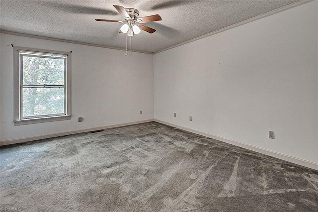 carpeted empty room with ceiling fan, a textured ceiling, and crown molding