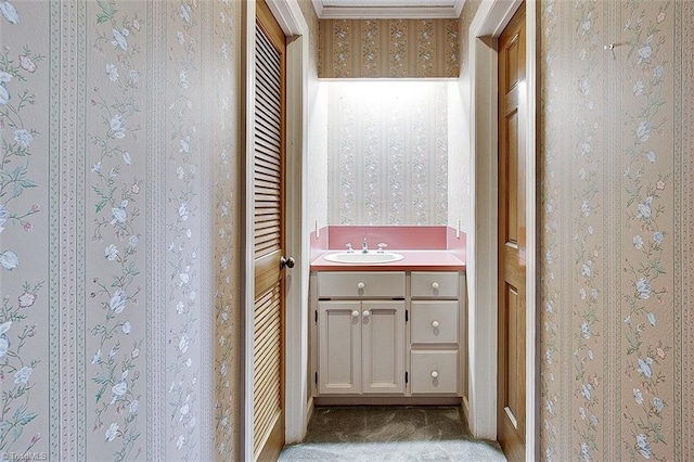 bathroom featuring vanity and crown molding