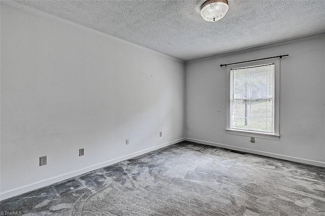 unfurnished room with a textured ceiling and carpet flooring