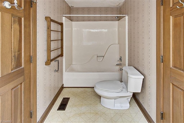 bathroom with  shower combination, toilet, and tile patterned floors