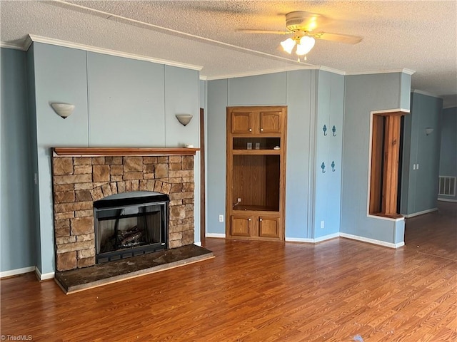 unfurnished living room with a textured ceiling, hardwood / wood-style flooring, ceiling fan, and crown molding