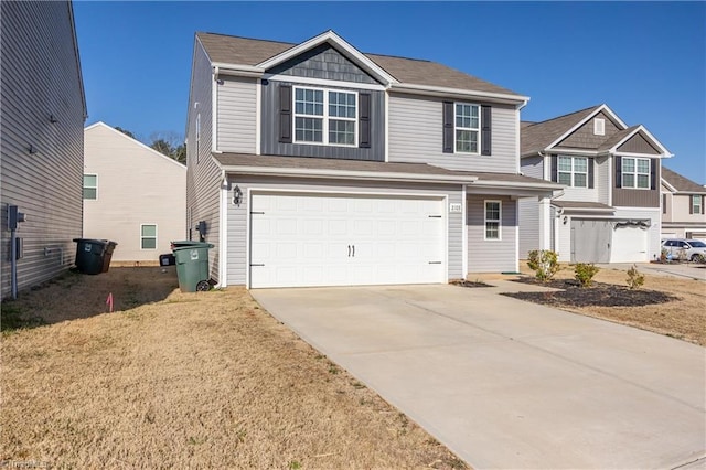 view of front facade with a garage and concrete driveway