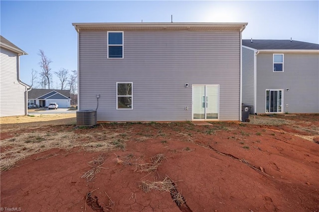 rear view of property with central air condition unit