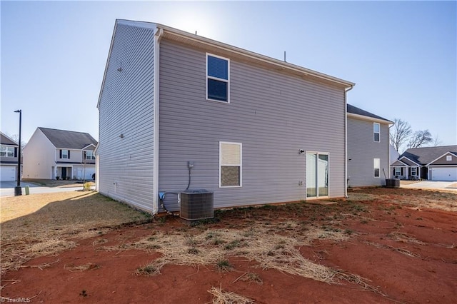 back of property with central air condition unit