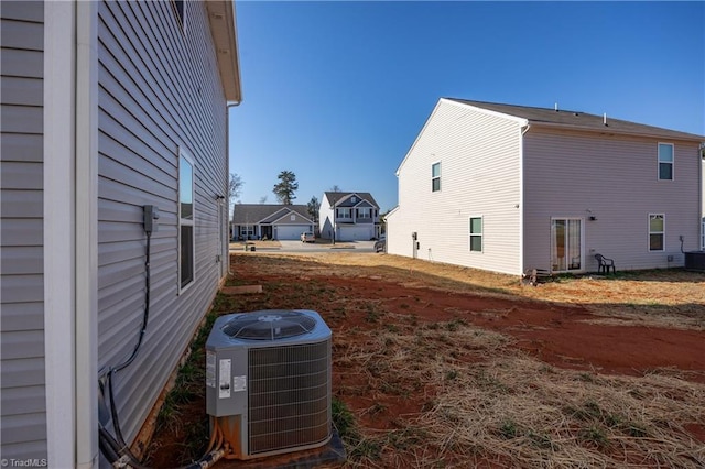 view of side of property with central AC unit