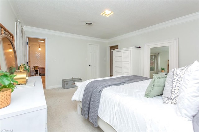 bedroom featuring a textured ceiling, crown molding, and light carpet