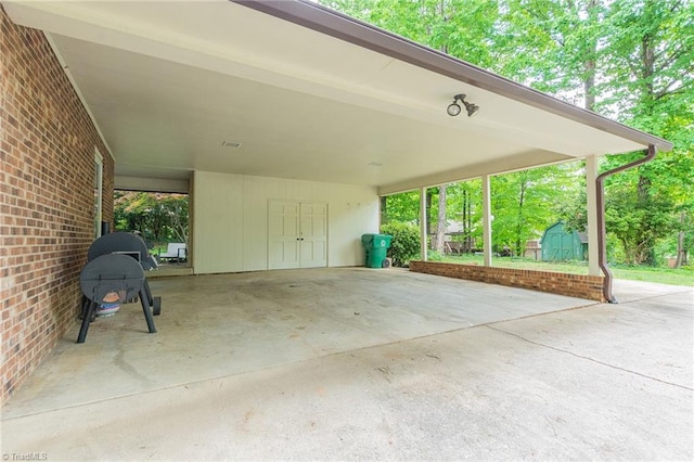 view of patio with a shed and a carport