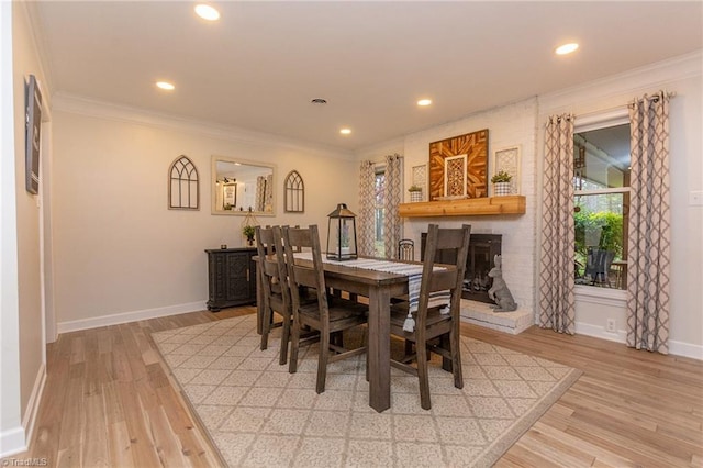 dining area featuring hardwood / wood-style floors and ornamental molding