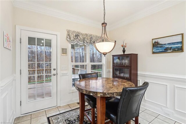 100 Wentworth Dr, Winston-Salem, NC 27107 - dining space with light tile patterned floors, wainscoting, and crown molding