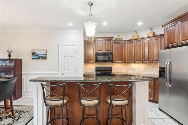 100 Wentworth Dr, Winston-Salem, NC 27107 - kitchen with light tile patterned floors, backsplash, black appliances, and crown molding