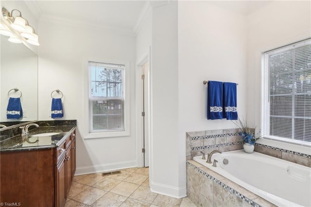 100 Wentworth Dr, Winston-Salem, NC 27107 - bathroom featuring vanity, a garden tub, visible vents, and ornamental molding
