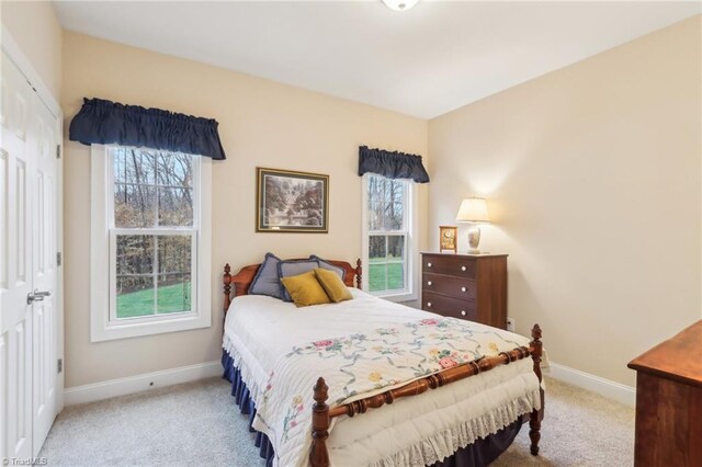 100 Wentworth Dr, Winston-Salem, NC 27107 - carpeted bedroom featuring baseboards