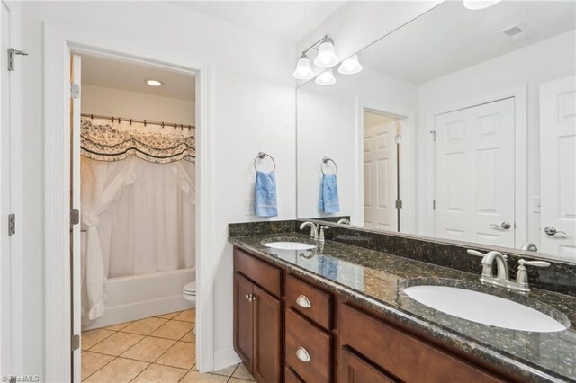 100 Wentworth Dr, Winston-Salem, NC 27107 - bathroom with tile patterned flooring, visible vents, double vanity, and a sink