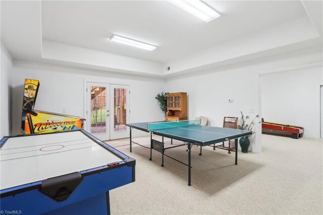 100 Wentworth Dr, Winston-Salem, NC 27107 - playroom with a tray ceiling, carpet flooring, and french doors