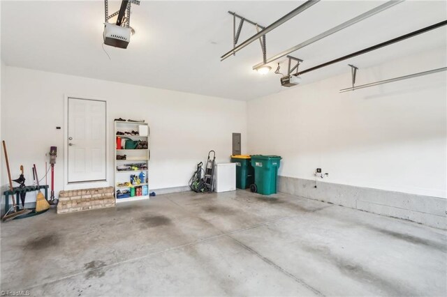 100 Wentworth Dr, Winston-Salem, NC 27107 - garage featuring electric panel and a garage door opener