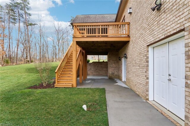 100 Wentworth Dr, Winston-Salem, NC 27107 - entrance to property with brick siding, roof with shingles, a lawn, a deck, and a patio area