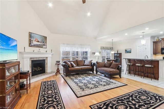100 Wentworth Dr, Winston-Salem, NC 27107 - living area with light wood finished floors, recessed lighting, a fireplace, and high vaulted ceiling