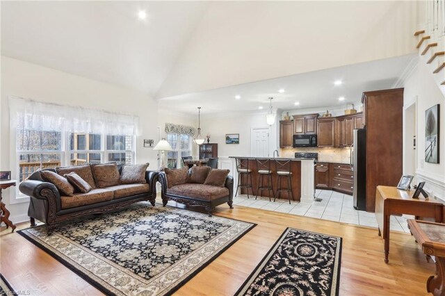 100 Wentworth Dr, Winston-Salem, NC 27107 - living area with recessed lighting, light wood-type flooring, and high vaulted ceiling