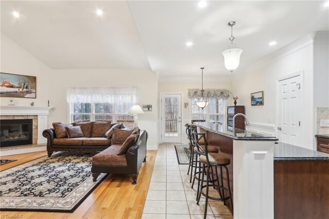 100 Wentworth Dr, Winston-Salem, NC 27107 - living room with plenty of natural light, lofted ceiling, and a tile fireplace