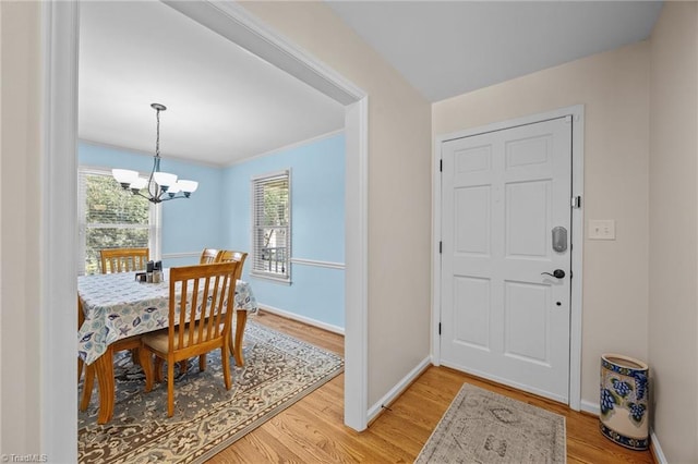 1941 Larkhill Dr, Kernersville, NC 27284 - foyer featuring light wood-type flooring, a chandelier, and healthy amount of natural light