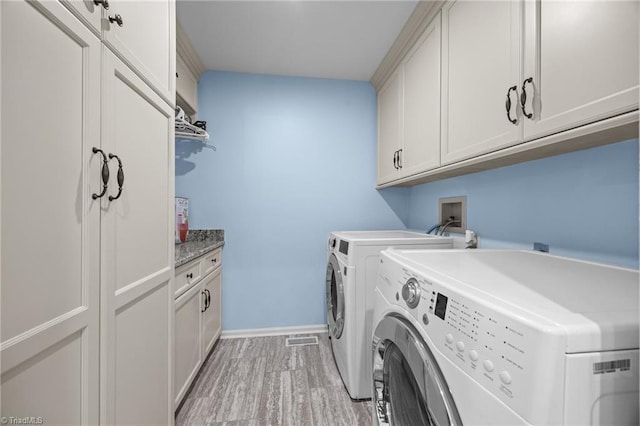 1941 Larkhill Dr, Kernersville, NC 27284 - washroom featuring washer and dryer and cabinet space