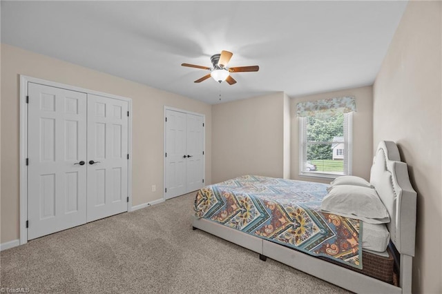 1941 Larkhill Dr, Kernersville, NC 27284 - carpeted bedroom with two closets and a ceiling fan