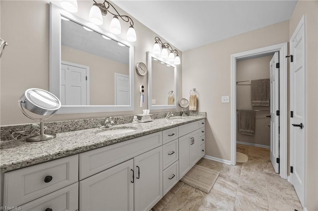 1941 Larkhill Dr, Kernersville, NC 27284 - full bathroom featuring double vanity and baseboards