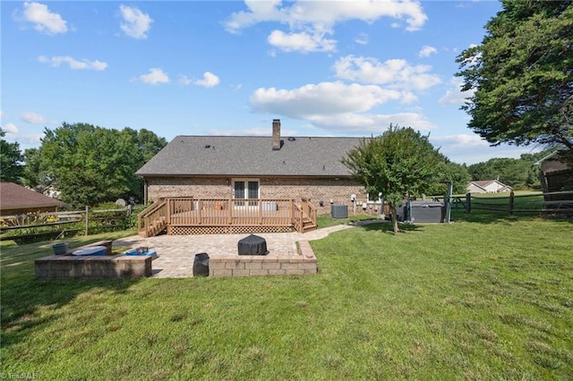 1941 Larkhill Dr, Kernersville, NC 27284 - back of property featuring a deck, a patio, a fenced backyard, and brick siding