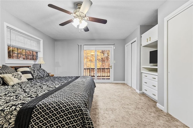 carpeted bedroom with ceiling fan, access to outside, and a closet