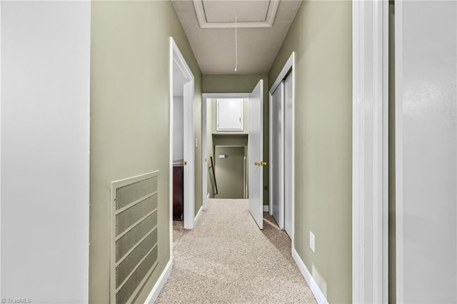 corridor with light colored carpet